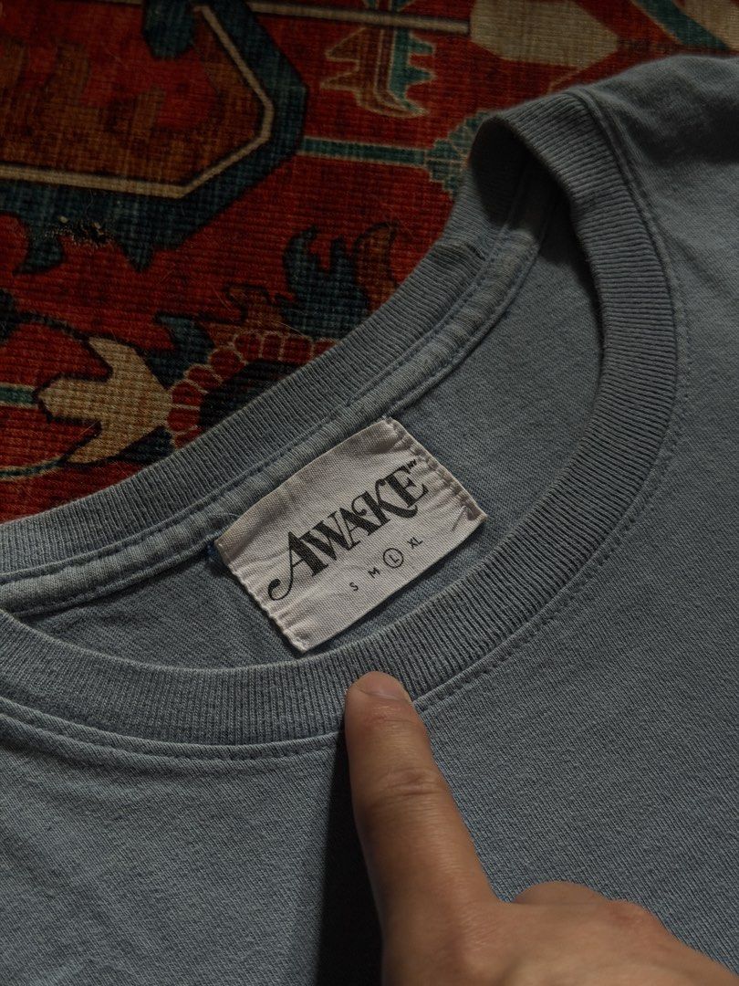 Awake NY Powder blue Tee (Category: Tshirts & Polo Shirts ) located in Manila. Submitted by localstreetwear (Listing ID 1467429183, Image 3). Description: Awake NY Powder Blue Tee 700 Used Large 20wX32L Antipolo City Sf shoulder by the buyer.