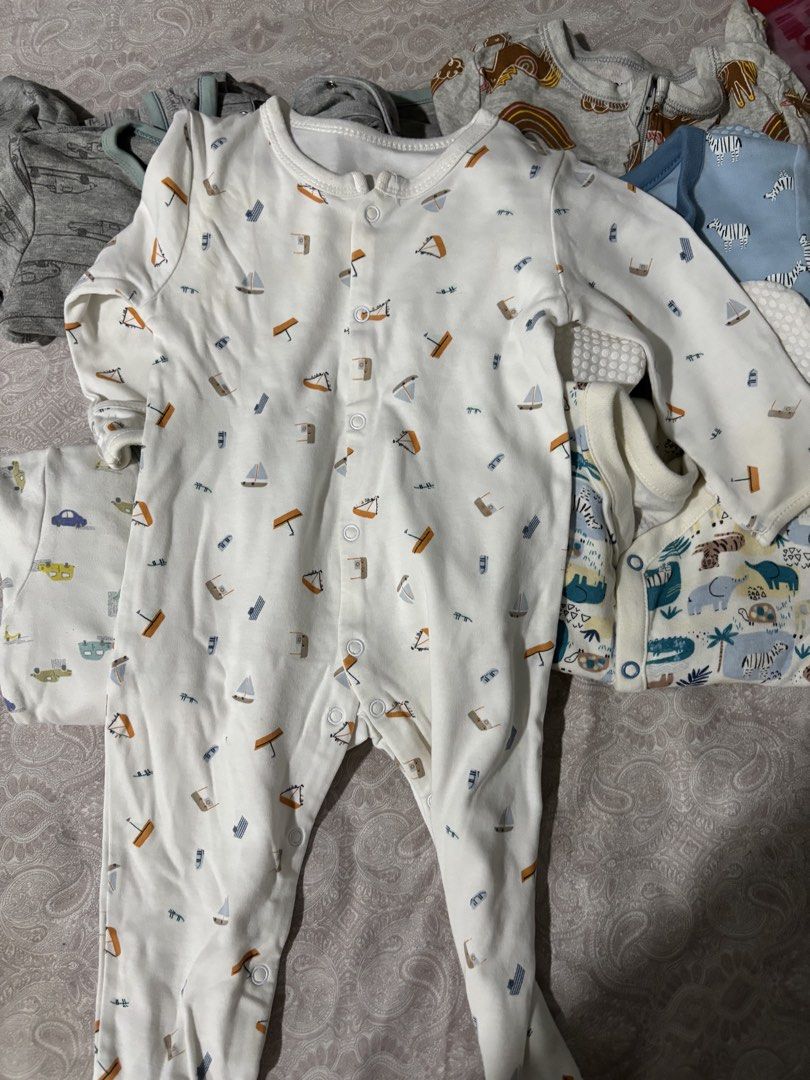 Baby Footed Rompers Sleepsuits Bundle (Category: Babies & Kids Fashion) located in Pasig City. Submitted by 7preloved (Listing ID 1467545852, Image 3). Description: - Bundle of baby boy footed rompers and sleepsuits - Soft and breathable 100% cotton material - Cute assorted prints (safari animals, zebras, cars, sailboats) - Front snap buttons for hassle-free diaper changes - Perfect for comfortable everyday wear.