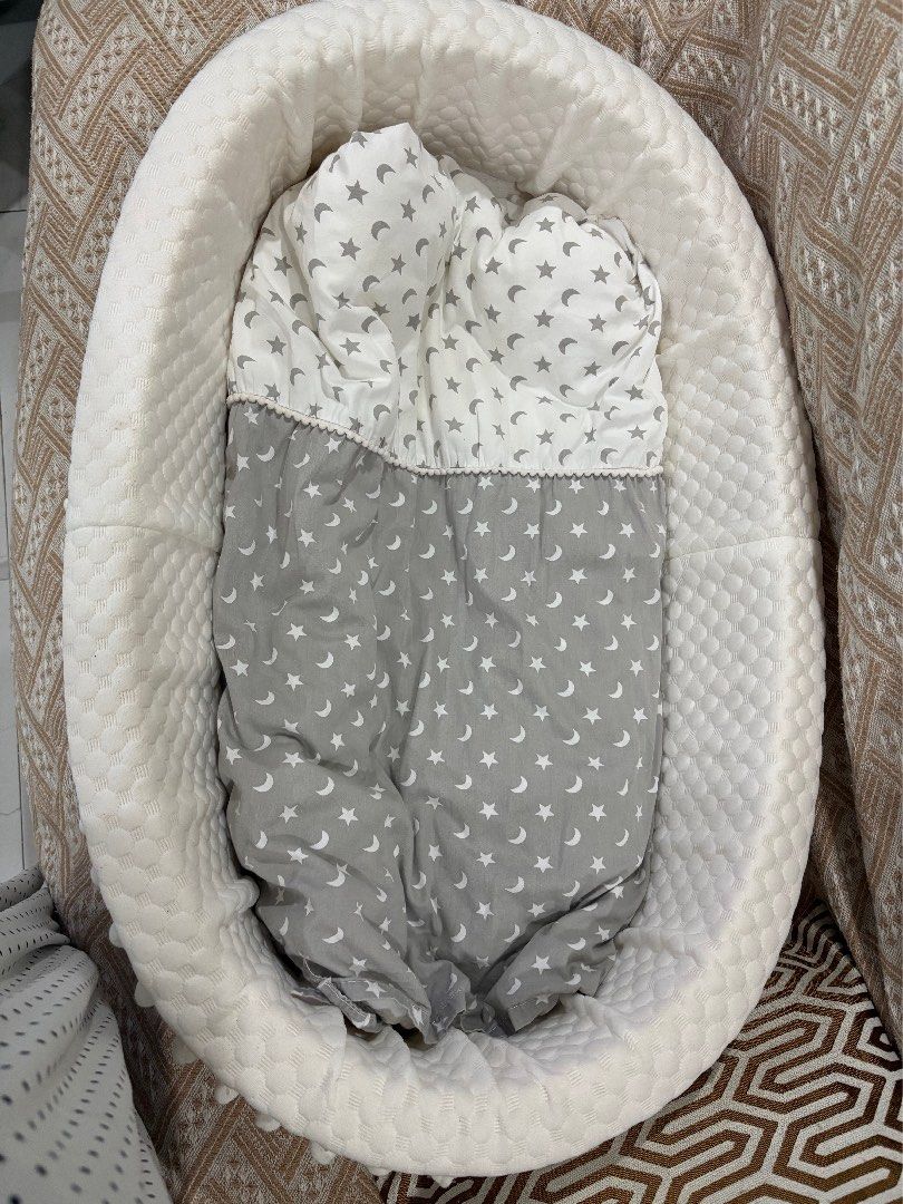 Baby Lounger Nest Bed Grey Star Pattern (Category: Children's Beds) located in Dasmarinas. Submitted by aileen0617 (Listing ID 1467593040, Image 2). Description: - Color/Design: White and grey with cute star and moon print - Dimensions: 90 x 50 x 20 cm outer diameter - Inclusions: Matching pillow and quilt set - Features: Soft quilted bumper all around and clean white textured fabric exterior - Use: Ideal for cozy naps and supervised lounging at 