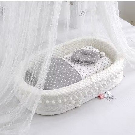 Baby Lounger Nest Bed Grey Star Pattern (Category: Children's Beds) located in Dasmarinas. Submitted by aileen0617 (Listing ID 1467593040, Image 3). Description: - Color/Design: White and grey with cute star and moon print - Dimensions: 90 x 50 x 20 cm outer diameter - Inclusions: Matching pillow and quilt set - Features: Soft quilted bumper all around and clean white textured fabric exterior - Use: Ideal for cozy naps and supervised lounging at 
