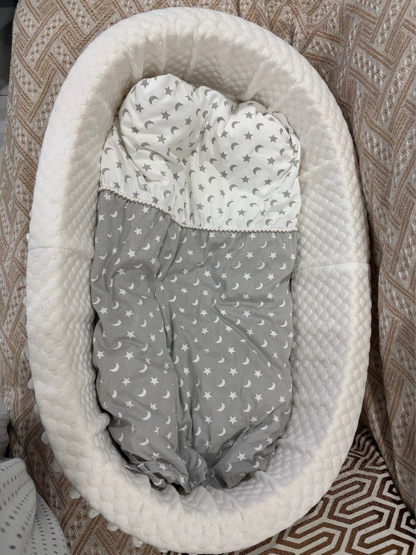 Baby Lounger Nest Bed Grey Star Pattern (Category: Children's Beds) located in Dasmarinas. Submitted by aileen0617 (Listing ID 1467593040, Image 1). Description: - Color/Design: White and grey with cute star and moon print - Dimensions: 90 x 50 x 20 cm outer diameter - Inclusions: Matching pillow and quilt set - Features: Soft quilted bumper all around and clean white textured fabric exterior - Use: Ideal for cozy naps and supervised lounging at 