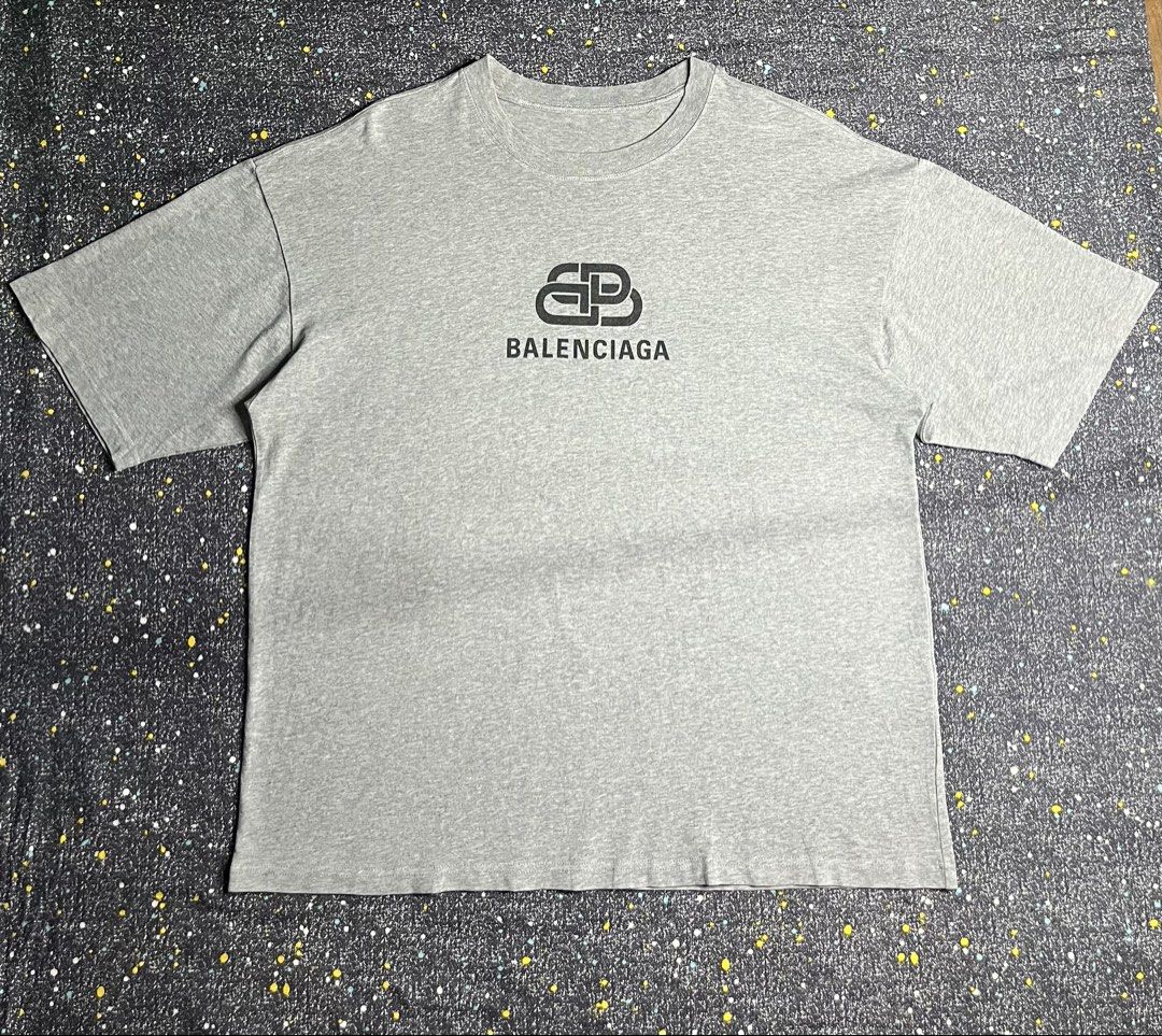 Balenciaga BB Logo Grey Tee (Category: Shirts) located in Manila. Submitted by lj_thrifter (Listing ID 1467378086, Image 1). Description: Balenciaga •Size Large •Dimes 23x28.5 •As new •Color rate 9.5/10 •Issue: cut tag •Can you check the details before your check out.