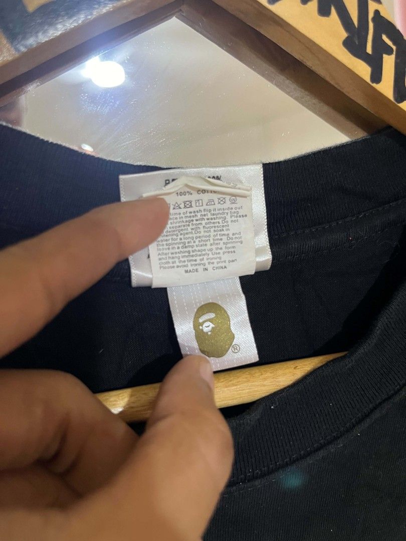 BAPE Tee (Category: Tshirts & Polo Shirts ) located in Cebu City. Submitted by lesthrift (Listing ID 1467527026, Image 3). Description: Size M on tag ( off ) Width 21 Length 28 Issue: Crack , see last photo.