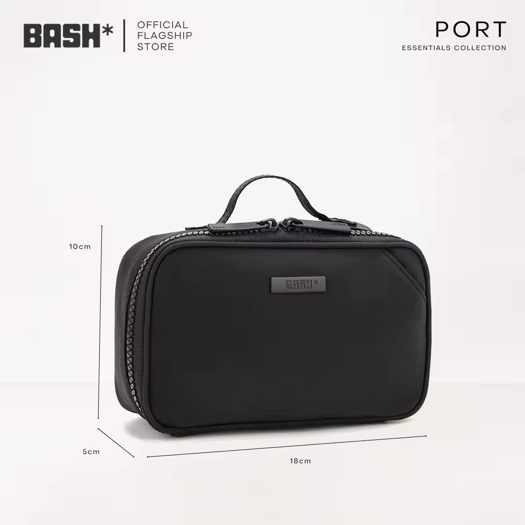 BASH PORT Essentials Collection Toiletry Bag (Category: Purses & Pouches) located in Paranaque City. Submitted by lizzymutia (Listing ID 1467372383, Image 2). Description: - Brand/Collection: BASH PORT Essentials - Price: Affordable & High Quality - Colors Available: Bone/White - Dimensions: Compact 18cm x 10cm x 5cm size - Material: Durable, water-resistant nylon - Features: Multiple interior mesh pockets and elastic loops for easy organization 