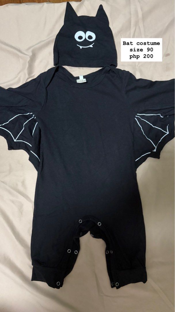 Bat costume size 90 (Category: Babies & Kids Fashion) located in Quezon City. Submitted by alauch (Listing ID 1467416694, Image 1). Description: - Item: Baby Bat Costume with matching hat - Size: 90 (printed on tag) - Price: ₱200 only - Design: Cute bat wings attached to sleeves and white facial details on the beanie - Feature: Convenient snap buttons along the bottom for hassle-free diaper changes - Perfect for Halloween, costume parties, or cut