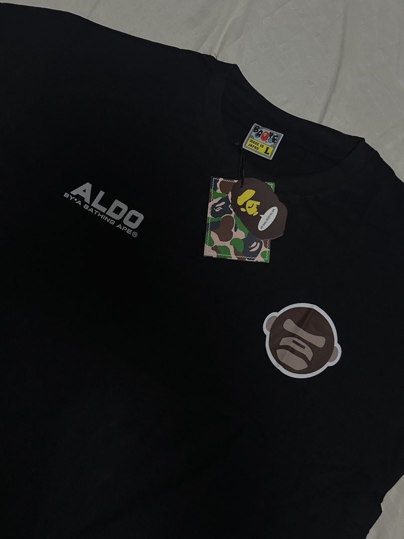 BATHING APE Universe Black T-Shirt (Category: Tshirts & Polo Shirts ) located in Manila. Submitted by jmdrgooddeals (Listing ID 1467378850, Image 2). Description: - Brand: AAPE by A Bathing Ape - Color: Black - Size: L (fits standard) - Condition: Brand new with tags (BNWT) - Origin: Made in Japan - Design: Iconic ape head logo on the front; large 'UNIVERSE' and 'AAPER' graphic print on the back - Quality: Clean graphics with zero cracking.
