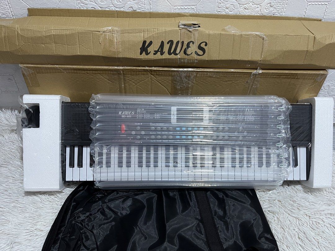 BD601 Piano keyboard with stand Brandnew (Category: Musical Instruments) located in Manila. Submitted by joharahmauna_18 (Listing ID 1463359076, Image 2). Description: KAWES BD601 Piano 61 Keys Digital Electric Piano Keyboard Portable Electronic Keyboard with stand and bag complete accessories . ✅ Brandnew w box no issue Inclusions: Box, Stand , Bag Microphone, Audio-line ,Charging Cable, Music stand, Lyric/ Sheet, Instruction, Keyboard Sticker L