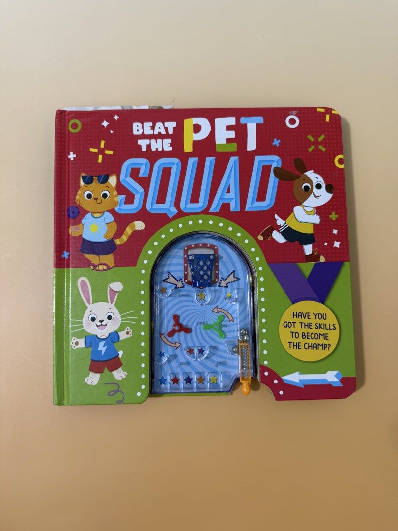 Beat The Pet Squad Interactive Children's Activity Book (Category: Children's Books) located in San Mateo. Submitted by gotchufinds (Listing ID 1467597806, Image 1). Description: - Title: Beat The Pet Squad children's board book - Cover Game: Built-in plastic pinball with mini basketball hoop, spinners, and spring shooter - Design: Features bright and fun cartoon animals (cat, dog, rabbit) - Function: Combines reading and interactive toy play for