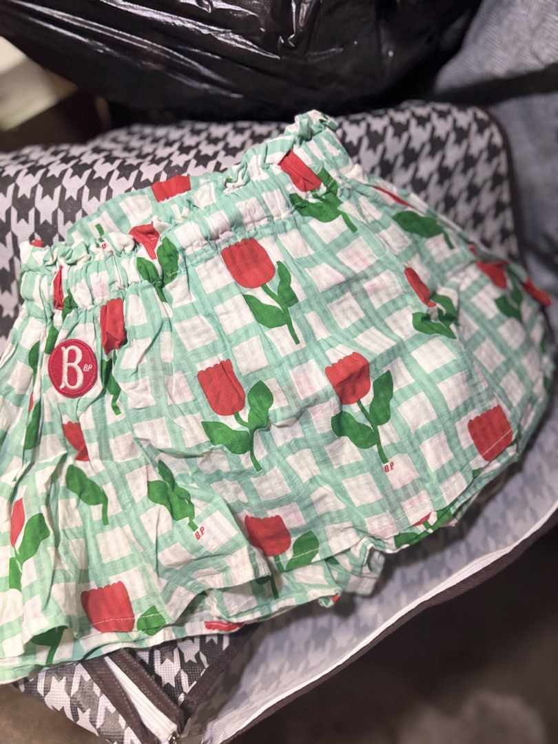 Bebe De Pino Tulip Gingham Shorts Size 110 (Category: Babies & Kids Fashion) located in Manila. Submitted by elainejoy047451 (Listing ID 1467453502, Image 2). Description: - Brand: Bebe De Pino - Size: 110 - Design: Green and white gingham check with all-over red tulip prints - Waistband: Elastic with cute ruffled trim - Details: Signature round red logo patch on the side - Material: Lightweight, breathable cotton for warm weather comfort - Condi