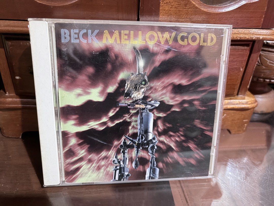 Beck Mellow Gold Audio CD Album (Category: CDs & DVDs) located in Tabaco. Submitted by cinemahilig (Listing ID 1467477268, Image 1). Description: - Artist & Album: Beck - Mellow Gold - Format: Audio CD in standard jewel case - Genre: Classic 90s alternative rock - Condition: Includes both disc and case - Perfect addition to any physical music collection.