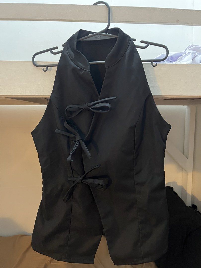 Beige Studio Black Halter Chinese/Macau Top Size S (Category: Sleeveless) located in Bacoor. Submitted by nova_ava (Listing ID 1467494643, Image 1). Description: - Brand: Beige Studio - USED ONCE only and bought for ₱900 on orange app (actual when worn photo on last slide) - Style: Black halter top with mandarin collar and three front bow ties - Size: S - Design: Split hem at the bottom - Versatility: Super versatile, easy to dress up or down.