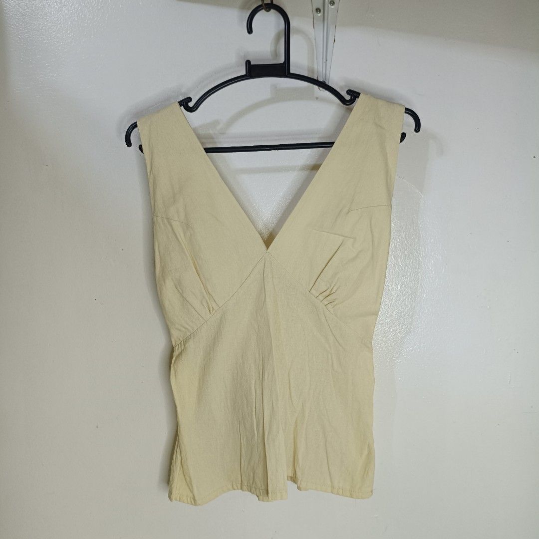 Beige V-Neck Sleeveless Smocked Back Top (Category: Sleeveless) located in Santa Maria. Submitted by abclosetph (Listing ID 1467423852, Image 1). Description: medida size! bust: 24-30 length: 21 - unused - color may vary due to lighting - manage your expectations, these are preloved items..