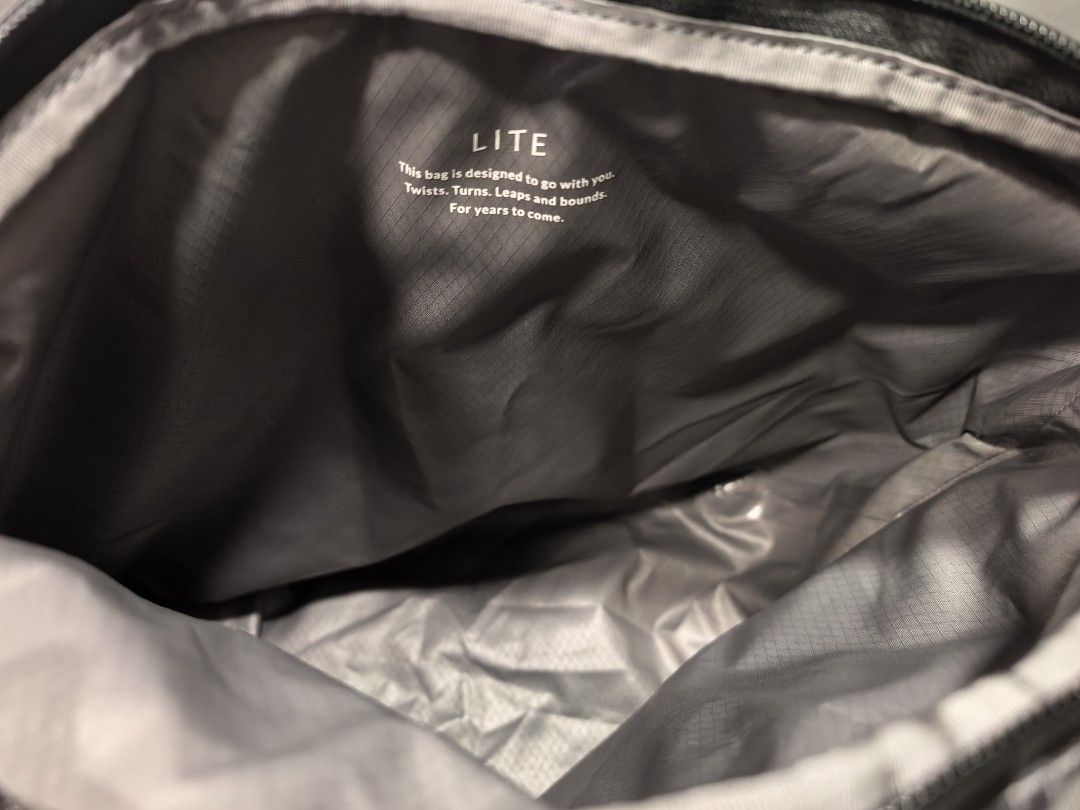 Bellroy Lite cooler caddy (Category: Sling Bags) located in Cagayan de Oro. Submitted by pootx (Listing ID 1467515933, Image 3). Description: - Brand: Bellroy Lite cooler caddy - Color: Black (Gridded Fabric) - Material: Durable, lightweight ripstop - Features: Adjustable strap & signature orange side accent tag - Interior: Spacious main compartment with clean lining and printed quote design - Condition: Excellent, well-maintained everyday carry.