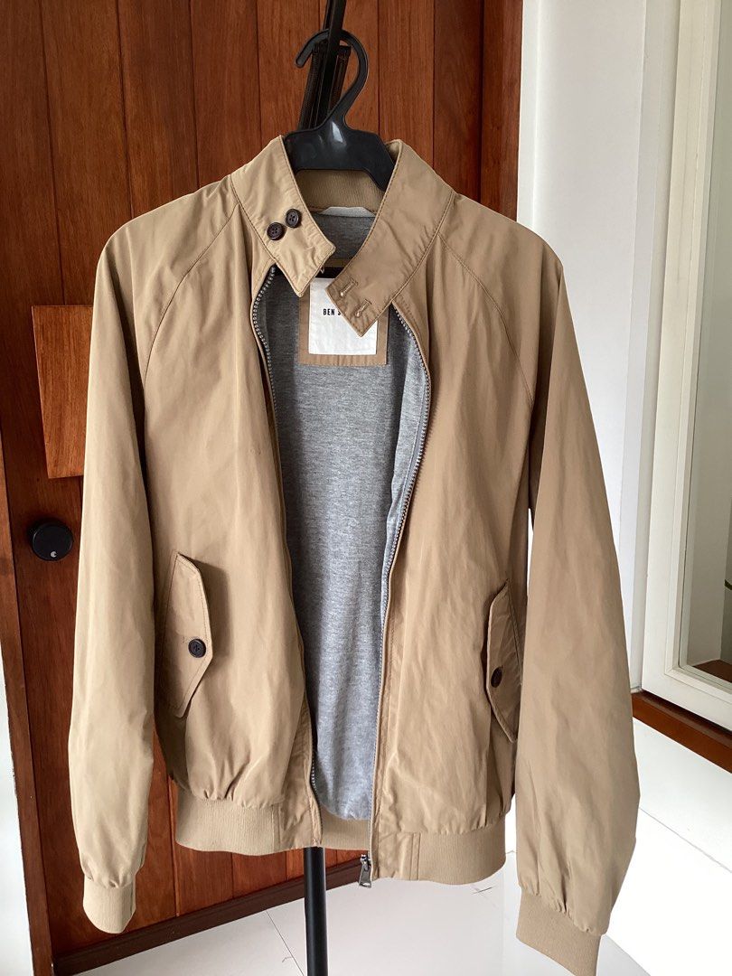 Ben Sherman Beige Bomber Jacket Size XS (Category: Coats, Jackets and Outerwear) located in Bacoor. Submitted by jyano (Listing ID 1467374693, Image 1). Description: - Brand: Ben Sherman - Style: Zip-up jacket - Color: Khaki beige - Size: XS - Lining: Grey heather cotton inside torso - Details: Ribbed cuffs and hem, back yoke design - Pockets: Two front flap pockets with buttons - Collar: High neck with double button closure - Condition: Clean al