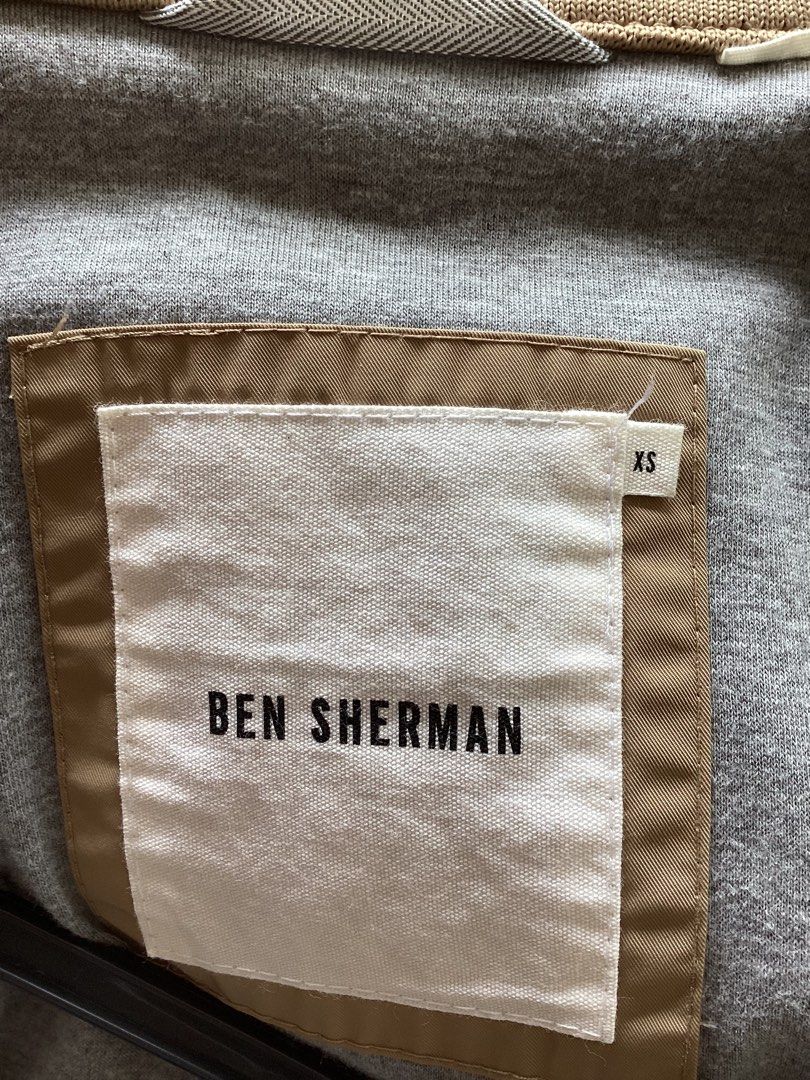 Ben Sherman Beige Bomber Jacket Size XS (Category: Coats, Jackets and Outerwear) located in Bacoor. Submitted by jyano (Listing ID 1467374693, Image 3). Description: - Brand: Ben Sherman - Style: Zip-up jacket - Color: Khaki beige - Size: XS - Lining: Grey heather cotton inside torso - Details: Ribbed cuffs and hem, back yoke design - Pockets: Two front flap pockets with buttons - Collar: High neck with double button closure - Condition: Clean al