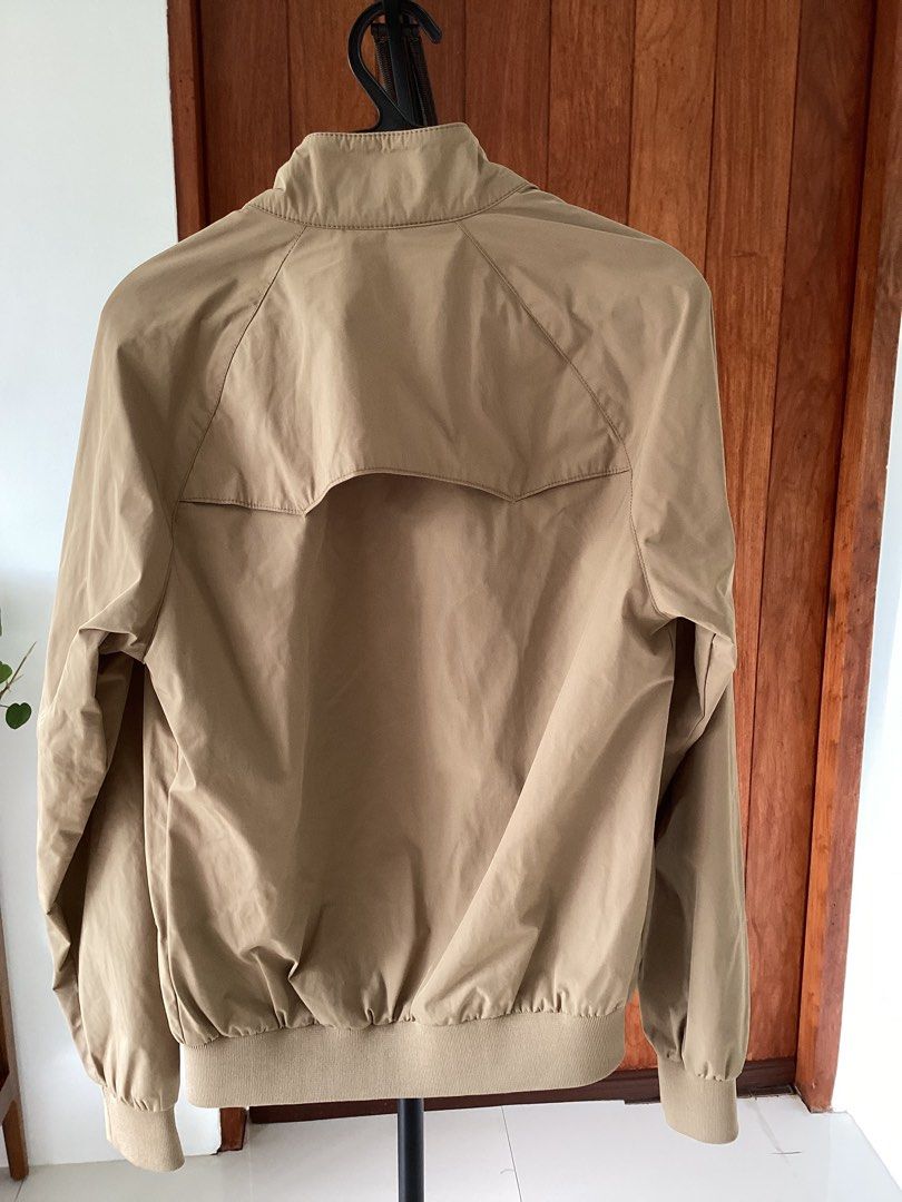 Ben Sherman Beige Bomber Jacket Size XS (Category: Coats, Jackets and Outerwear) located in Bacoor. Submitted by jyano (Listing ID 1467374693, Image 2). Description: - Brand: Ben Sherman - Style: Zip-up jacket - Color: Khaki beige - Size: XS - Lining: Grey heather cotton inside torso - Details: Ribbed cuffs and hem, back yoke design - Pockets: Two front flap pockets with buttons - Collar: High neck with double button closure - Condition: Clean al