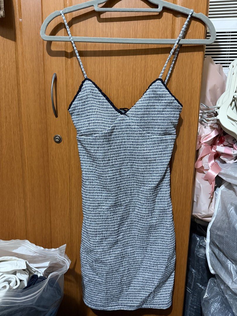 Bershka spaghetti strap bodycon dress (Category: Dresses) located in Muntinlupa City. Submitted by biancaagbscloset (Listing ID 1467537431, Image 1). Description: - Textured blue and white knit fabric - Bodycon fit with stretchy material that hugs the body - Thin spaghetti straps and V-neck with dark trim - Versatile for casual outings or night outs - Easy to style with sandals or heels.