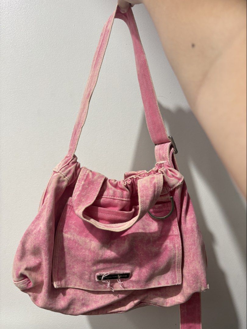 Beyond The Vines Pink Denim Shoulder Bag (Category: Shoulder Bags) located in Manila. Submitted by kennymonkie (Listing ID 1467444733, Image 1). Description: - GETTING RID OF MY SISTERS GIFTS FROM HER EX BF 🪬🧿 f that cheater - Brand: Beyond The Vines - Style: Pink acid wash denim shoulder/hobo bag - Features: Front pocket with metal logo badge and D-ring detail - Straps: Adjustable shoulder strap and integrated ruched handles - Use: Casual ever