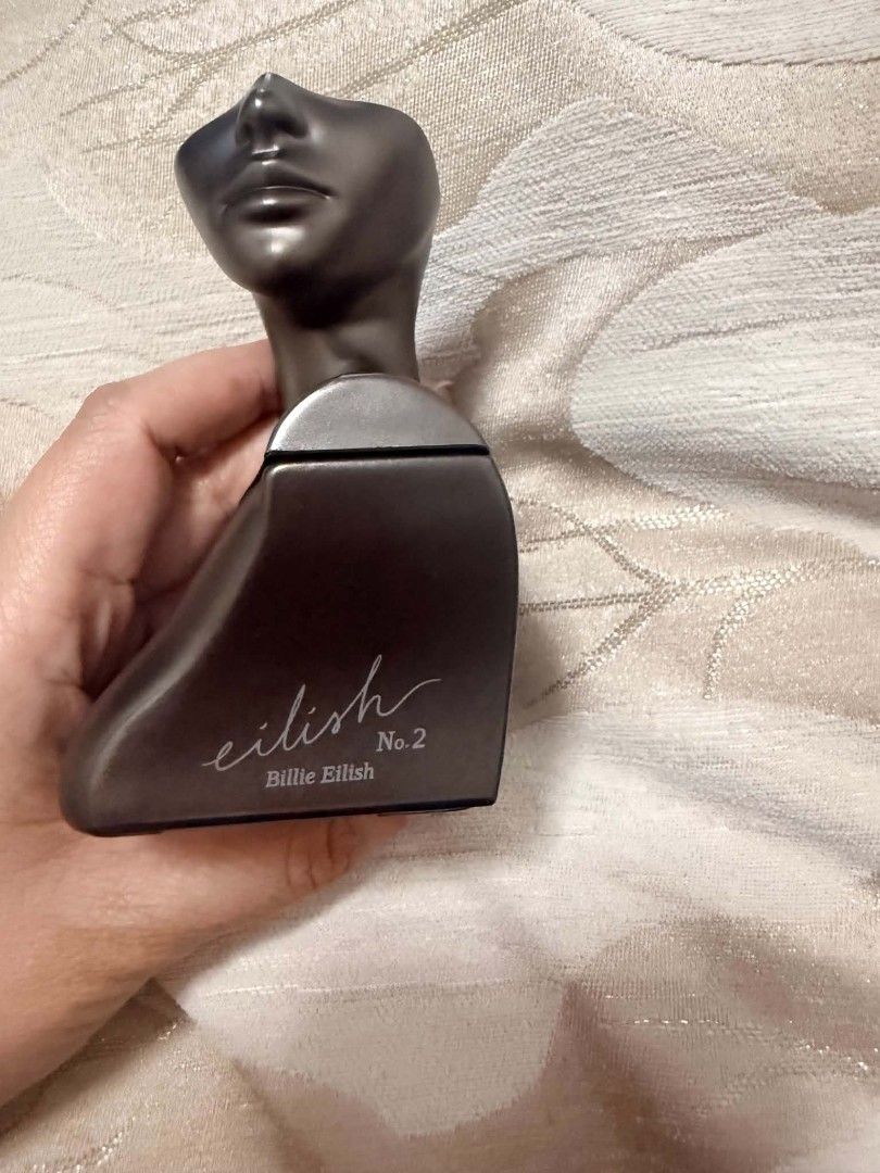 Billie Eilish No. 2 Eau de Parfum (Category: Fragrance & Deodorants) located in Pinamalayan. Submitted by chay0921 (Listing ID 1467526295, Image 2). Description: Billie Eilish No. 2 fragrance. Gunmetal bust bottle design. Smoked grey metallic finish. Spray nozzle at the top. Batch sticker on the flat base. Bottle only, no box included..
