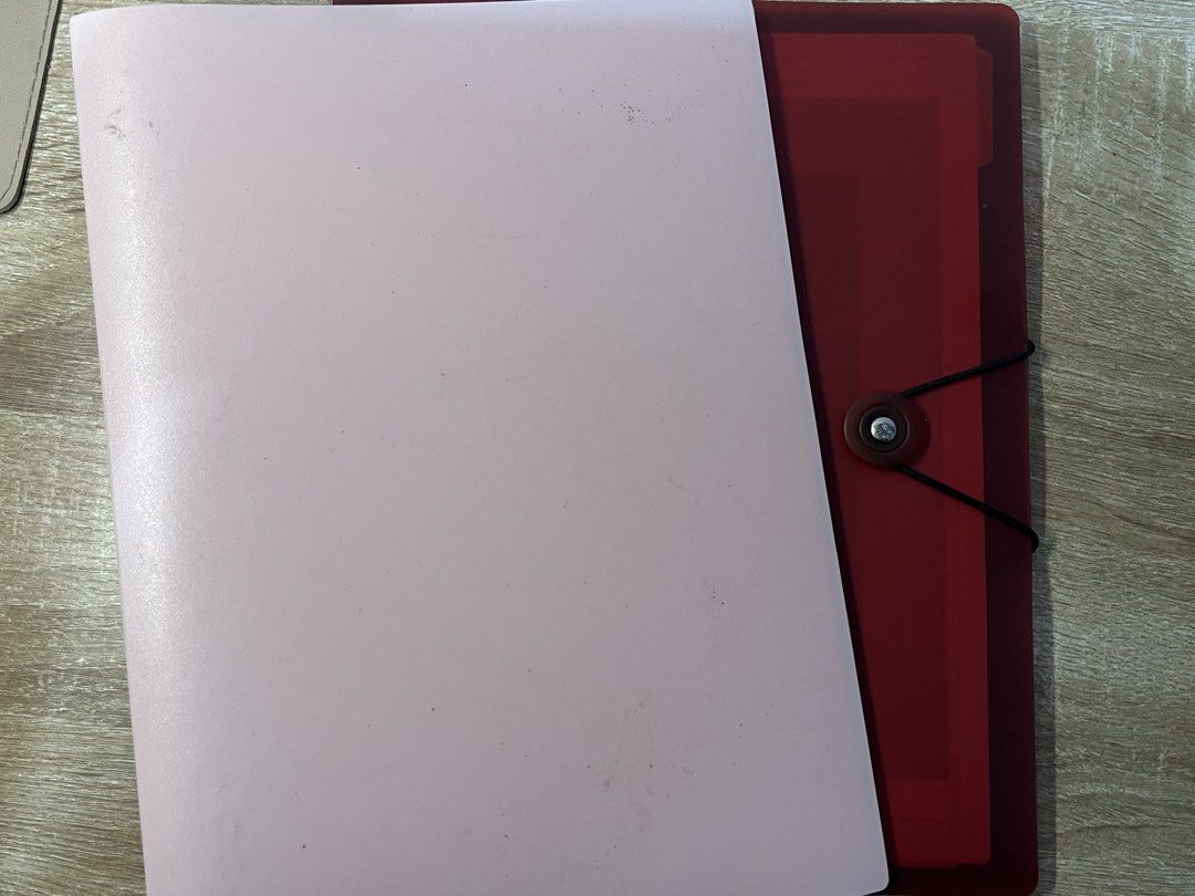 BINDERS with free refills! | PINK AND RED (Category: Stationery & School Supplies) located in Manila. Submitted by ilovethings17 (Listing ID 1467466315, Image 1). Description: - 2 plastic document folders in pink and dark red - Features an elastic band closure on the red folder - Perfect for organizing school notes and documents - Standard letter-size paper fits easily inside - Condition: Minor surface dirt and smudges due to normal storage, but 