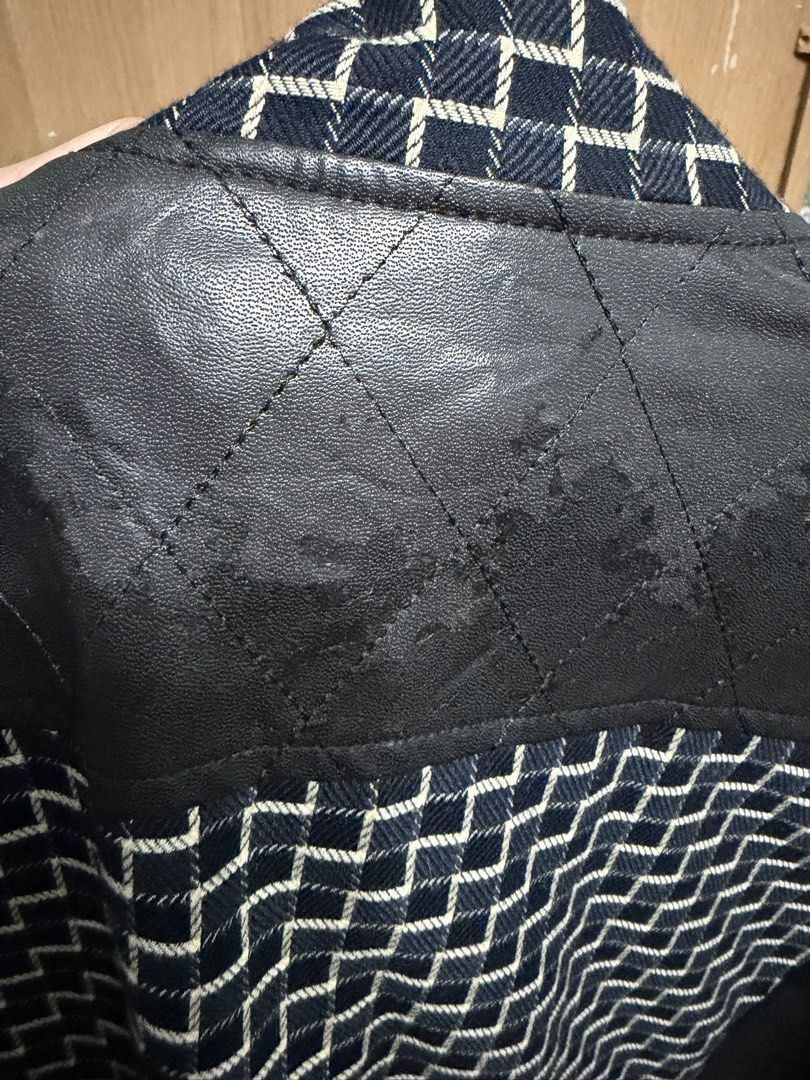 Black and Blue Patterned Jacket with Faux Leather Shoulders (Category: Coats, Jackets and Outerwear) located in Manila. Submitted by marclouiea70819 (Listing ID 1467562579, Image 3). Description: - Design: Black and blue geometric pattern with solid black sleeves - Details: Quilted faux leather panels on shoulders and back yoke, small chest zipper pocket - Closure: Zip-up front with snap buttons - Interior: Patterned grey lining with crown graphi