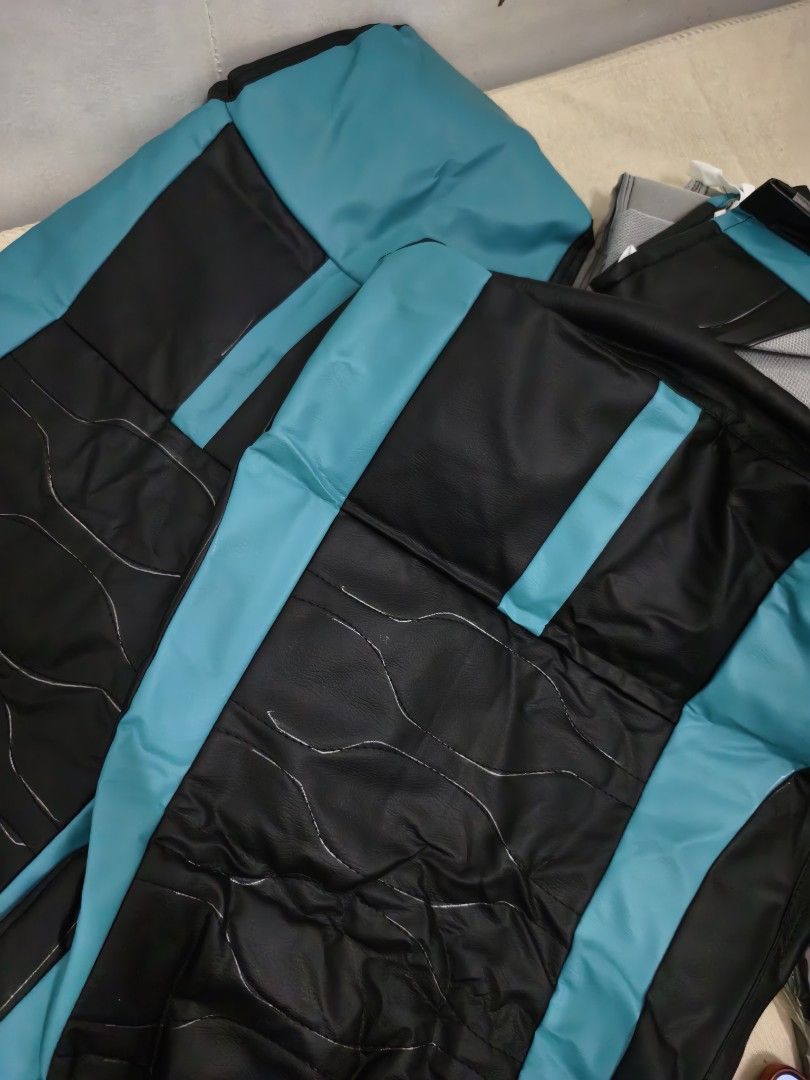 Black and Turquoise Car Seat Covers Set (Category: Car Seats) located in Angeles City. Submitted by measaliman02351 (Listing ID 1467430026, Image 2). Description: Brand new black and turquoise faux leather car seat covers with a stylish center stripe and wavy stitch design. Complete set for both front and rear seats, ready for easy installation. CANTER TRUCK CAR SEAT COVER SET .