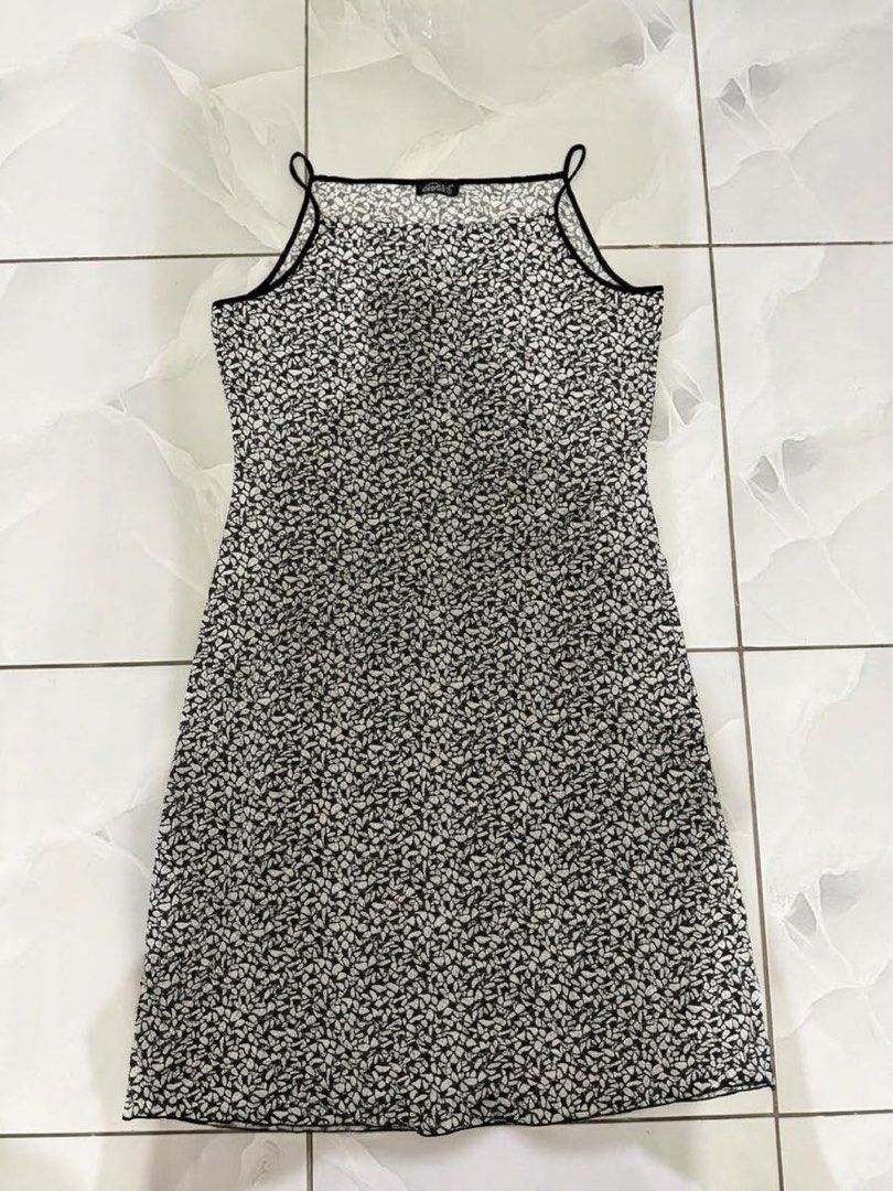Black and white patterned spaghetti strap midi dress (Category: Dresses) located in Cagayan de Oro. Submitted by ninaaam (Listing ID 1467476553, Image 1). Description: - Monochrome abstract print - Square neckline with thin black straps - Chic black piping details - Knee-length cut - Lightweight and breathable material - Great for warm weather or layering over a tee.