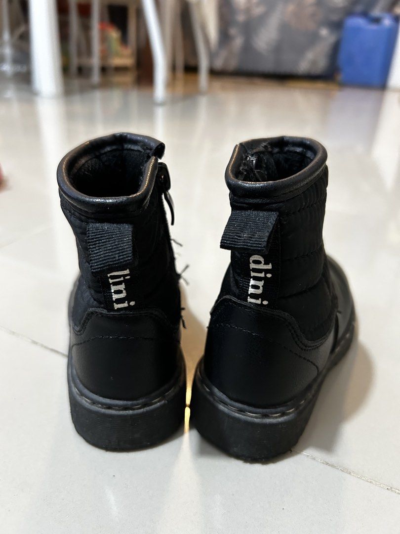 Black boots kids size 25 (Category: Babies & Kids Fashion) located in Antipolo. Submitted by mommytj (Listing ID 1467480910, Image 3). Description: - Color: Black - Size: 25 (indicated on outsole) - Material: Quilted fabric upper with leather-look lower section - Features: Convenient side zipper and back pull tab with lettering - Sole: Sturdy grooved rubber for extra grip - Condition: Worn a few times with normal wear on the soles.