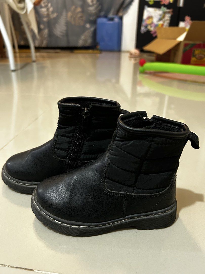 Black boots kids size 25 (Category: Babies & Kids Fashion) located in Antipolo. Submitted by mommytj (Listing ID 1467480910, Image 1). Description: - Color: Black - Size: 25 (indicated on outsole) - Material: Quilted fabric upper with leather-look lower section - Features: Convenient side zipper and back pull tab with lettering - Sole: Sturdy grooved rubber for extra grip - Condition: Worn a few times with normal wear on the soles.