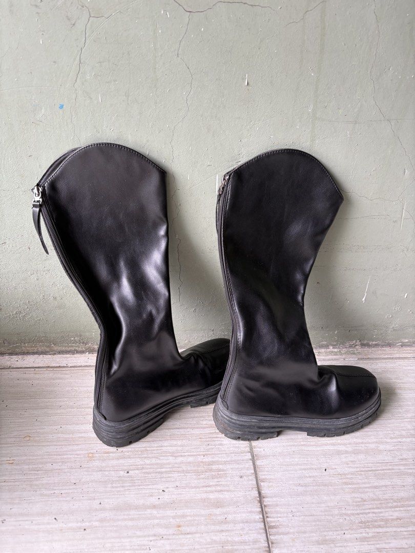 Black knee-high chunky platform boots with side zipper (Category: Boots) located in Caloocan City. Submitted by larenpreloved (Listing ID 1467424579, Image 1). Description: - Style: Knee-high boots with chunky platform soles and rounded toe - Material: Faux leather - Details: Full-length side zipper with pull tab and front center seam - Perfect for effortless edgy outfits RFS: decluttering Used twice .