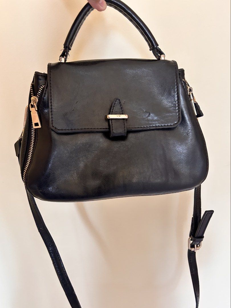 Black Leather Crossbody Bag (Category: Cross-body Bags) located in Batangas. Submitted by han.jpg (Listing ID 1467484666, Image 1). Description: - selling as is - with signs of usage - onhand, ready to ship - pay as you mine - MOP: gcash, maribank - MOD: J&T (54 sf within luzon) - location: batangas.