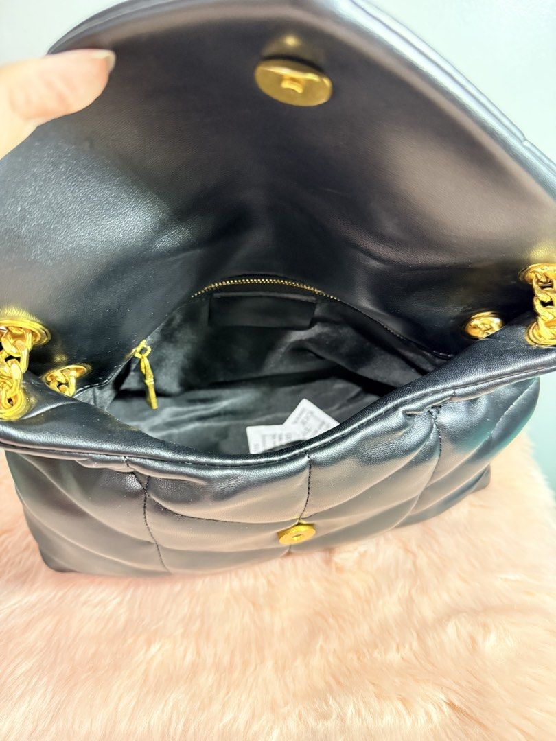 Black Leather Puffer Shoulder Bag (Category: Shoulder Bags) located in Quezon City. Submitted by shaberbree (Listing ID 1467520402, Image 2). Description: - Material: Premium black quilted lambskin leather - Hardware: Elegant gold-tone with iconic YSL monogram - Straps: Double chain straps with comfortable leather shoulder guards - Closure: Secure magnetic flap closure - Interior: Fabric-lined with a convenient zip pocket - Condition: Excellent /