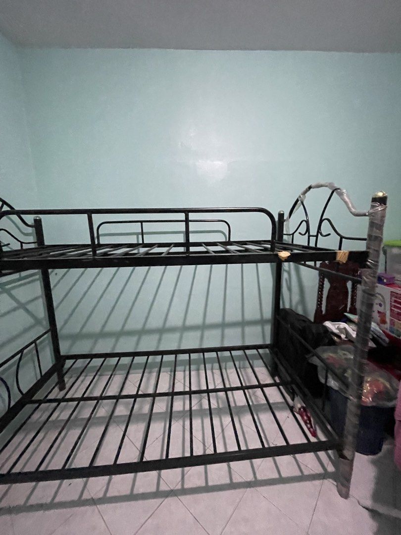 Black Metal Bunk Single Bed Frame (Category: Bed Frames & Mattresses) located in Cavite. Submitted by unusedcollections (Listing ID 1467446238, Image 2). Description: - Standard twin size black metal bunk bed frame - Sturdy slatted base with solid metal construction (complete slats) - Features safety rails on the top bunk for secure sleeping - Beautiful decorative arched headboard design - Easily dismantles for convenient transport and moving.