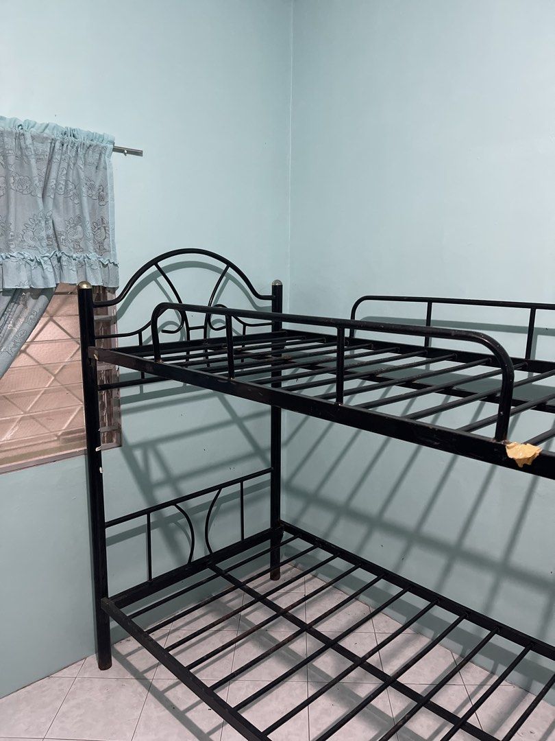 Black Metal Bunk Single Bed Frame (Category: Bed Frames & Mattresses) located in Cavite. Submitted by unusedcollections (Listing ID 1467446238, Image 3). Description: - Standard twin size black metal bunk bed frame - Sturdy slatted base with solid metal construction (complete slats) - Features safety rails on the top bunk for secure sleeping - Beautiful decorative arched headboard design - Easily dismantles for convenient transport and moving.