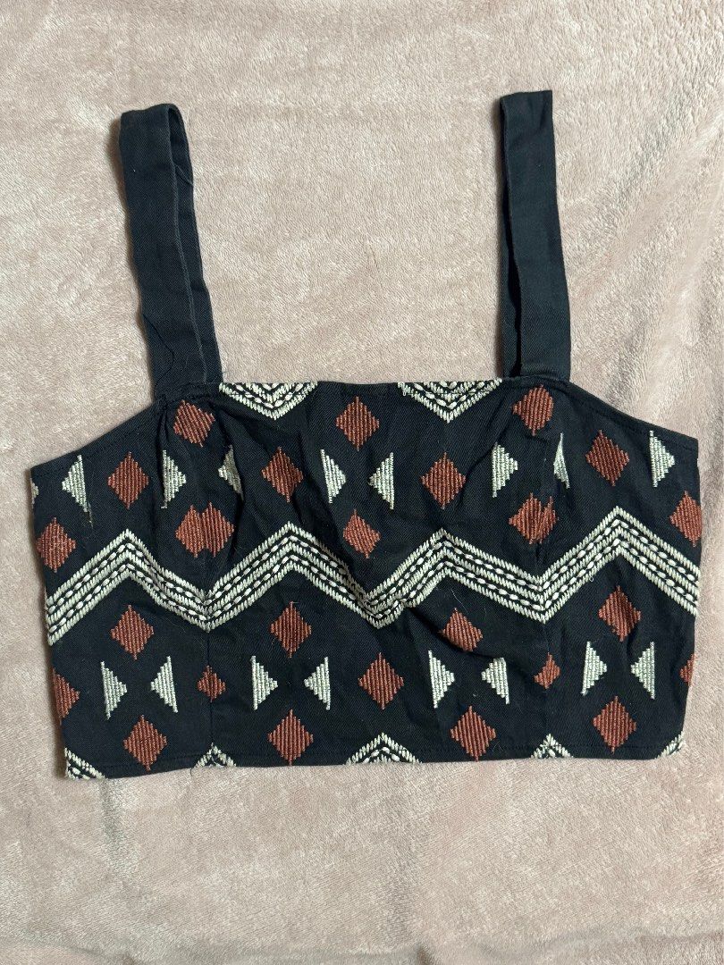 Black patterned crop top with shoulder straps (Category: Sleeveless) located in Quezon City. Submitted by ky_aly_ (Listing ID 1467492893, Image 1). Description: - Color: Black - Design: Vertical zigzag pattern with white and brown geometric embroidery (triangles and diamonds) - Straps: Two secure black shoulder straps - Style: Crop top, great for casual outings and sunny weather .