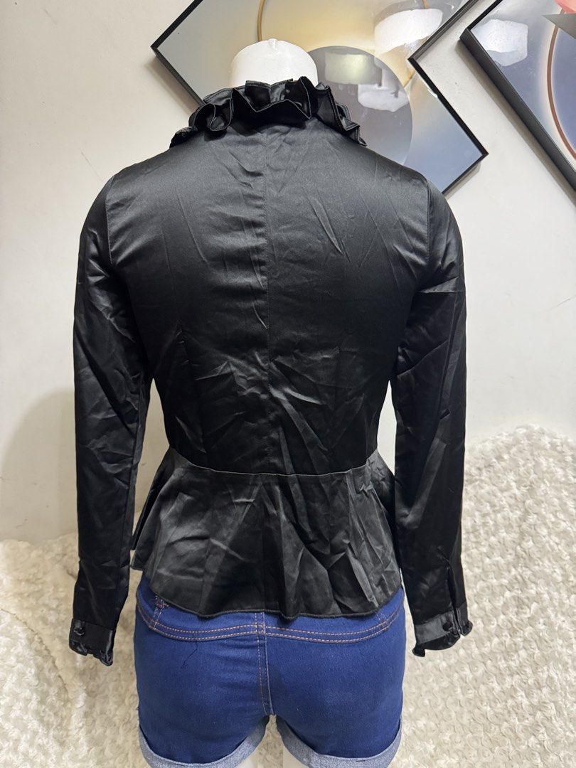 Black Satin Ruffle Front Long Sleeve Blouse (Category: Blouses) located in Marikina City. Submitted by lorradel (Listing ID 1467513734, Image 3). Description: - Color: Elegant Black - Material: Smooth satin with subtle sheen - Design: Dramatic ruffle trim along the front placket and neckline - Fit: Fitted bodice with a stylish flared peplum hem - Details: Long sleeves and hidden button closure - Condition: Excellent / Ready to wear - Perfect for: