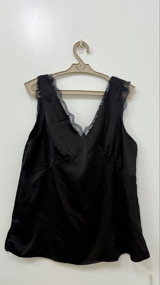 Black satin top (Category: Sleeveless) located in Manila. Submitted by ksunbeams (Listing ID 1467472368, Image 1). Description: Black satin top 🩶 🌀twice used only! 🌀 Fits M-L 🌀 Dm for when worn .