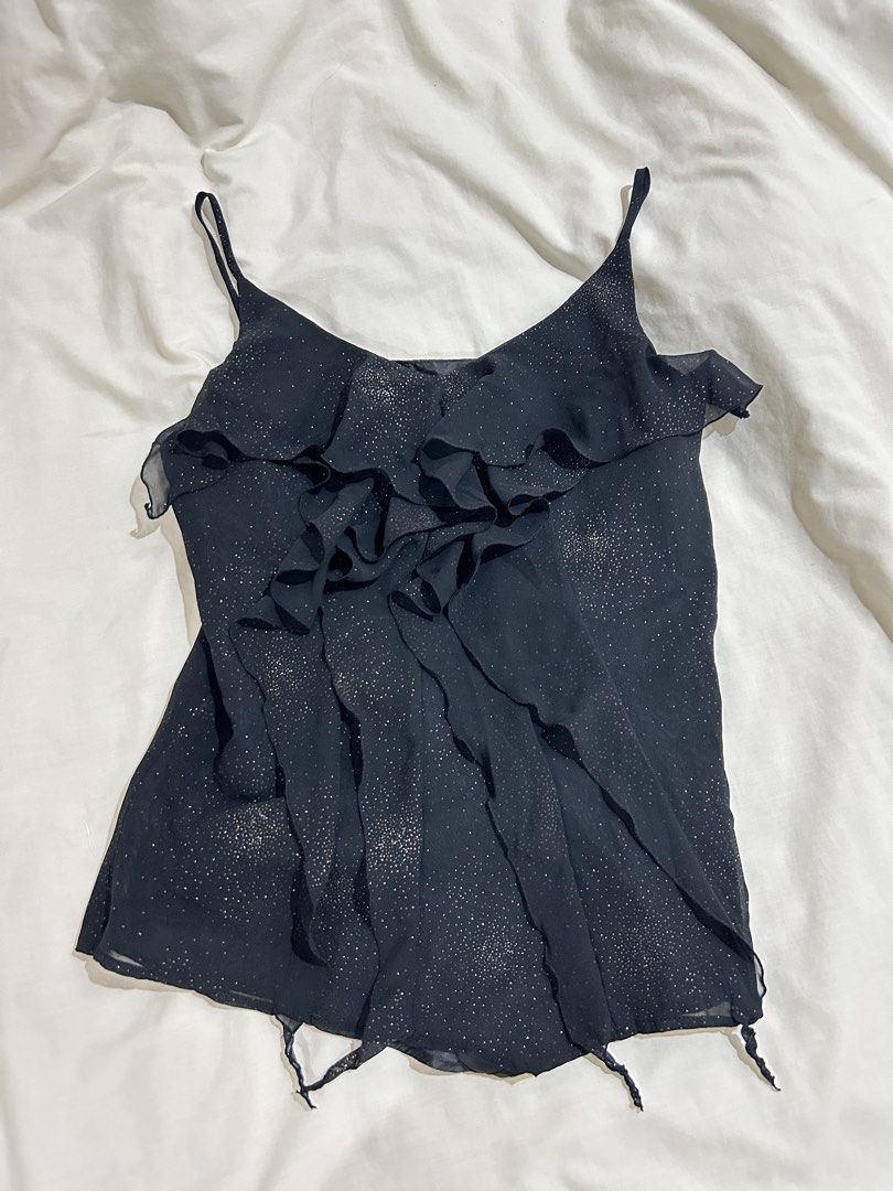 Black Shimmer Ruffle Camisole Tank Top (Category: Sleeveless) located in Cavite. Submitted by lj.collection (Listing ID 1467412156, Image 2). Description: ✦ Best fits xs-s ✦ Got this on an ig shop for ₱290 ✦ worn once only but no flaws ✦ details: black with all-over sparkly glitter details, layered front ruffle with thin spaghetti straps + zipper on side Light, sheer fabric ideal for nights out ✦ MOP: Gcash, Maya, Maribank, BDO ✦ MOD: J&T, Lalamo