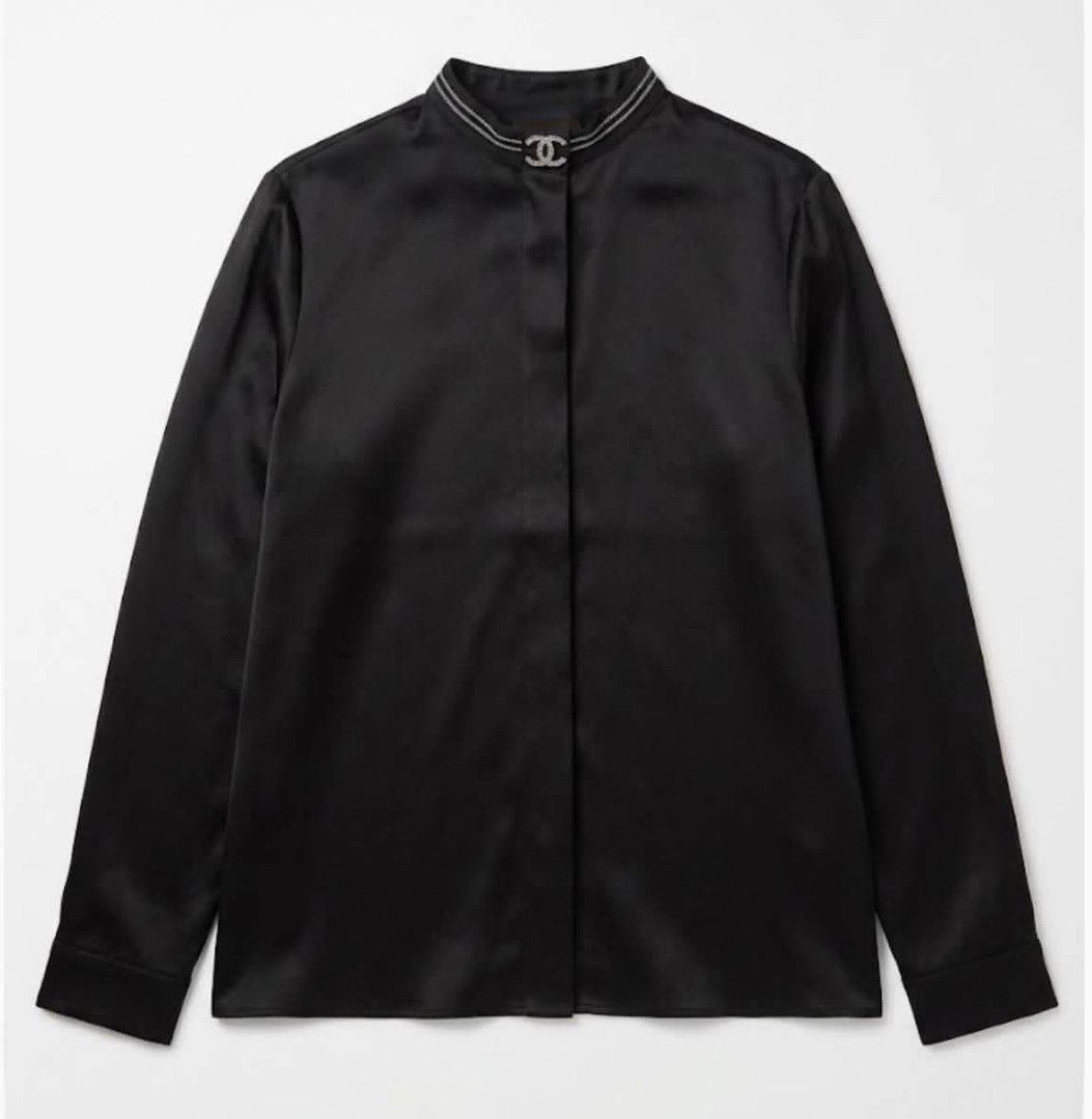 Black Silk Blouse with embellished collarline (Category: Blouses) located in Donsol. Submitted by saksthriftavenuebyluckymaria8 (Listing ID 1467383893, Image 1). Description: - Material: Smooth luxury silk - Color: Classic black - Design: High collar with silver beading and logo at neckline - Details: Long sleeves : Tailored, timeless wardrobe staple - Condition: Excellent Black blouse features a band/mandarin collar accented with a jeweled ogo b