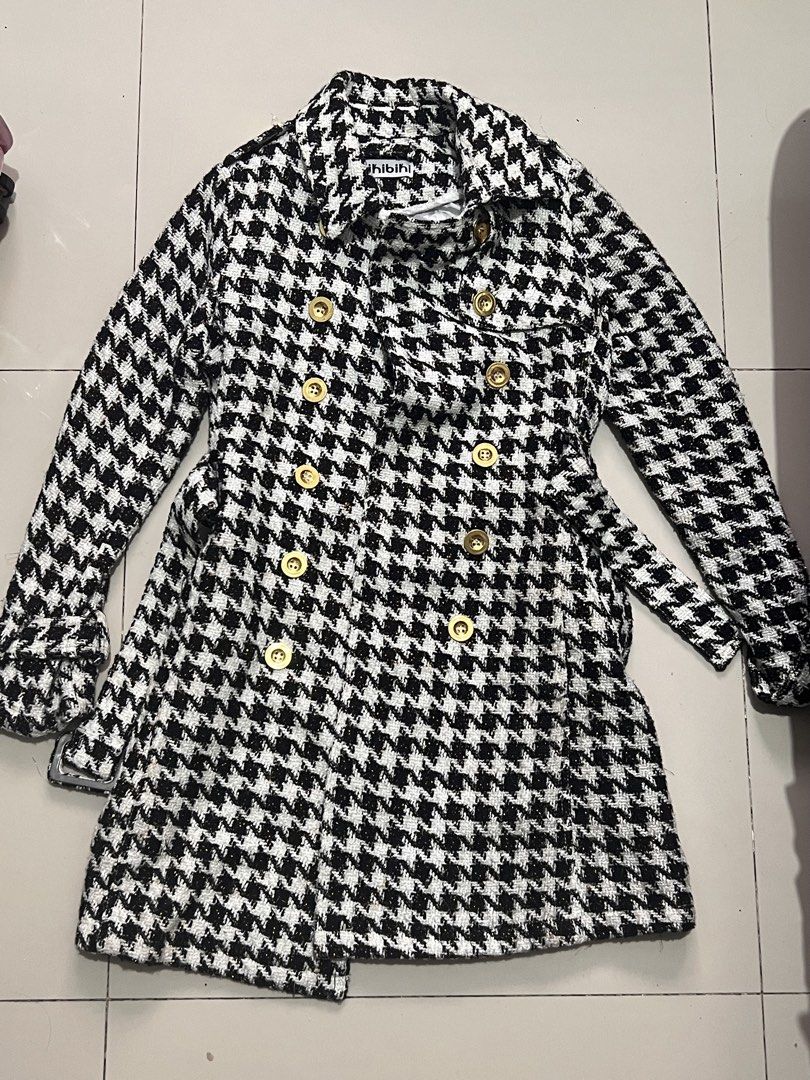 Black white tweed Trench Coat (Category: Coats, Jackets and Outerwear) located in Manila. Submitted by vandetoria (Listing ID 1467388918, Image 1). Description: - Brand: Hibibi - Pattern: Classic black and white houndstooth - Material: Thick, warm tweed-like woven fabric - Closure: Double-breasted front with shiny gold buttons - Details: Classic collar, long sleeves with button tab cuffs, and includes a matching buckled belt - Fit: True to standa