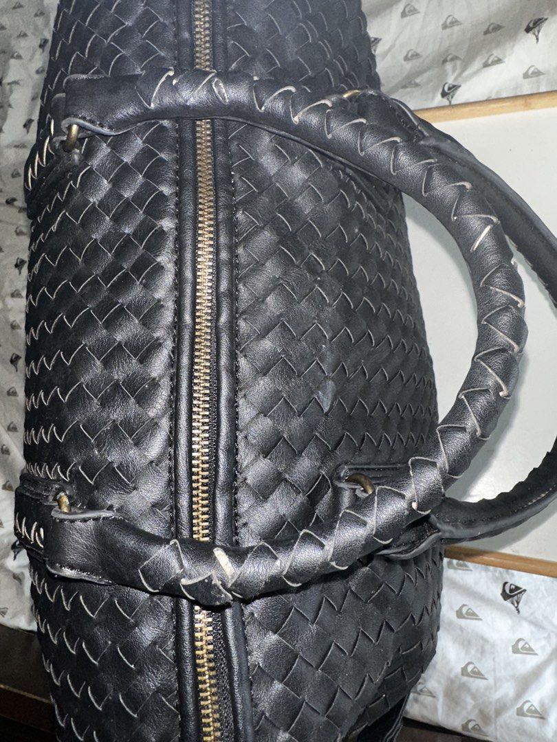 Black Woven Tote Bag with Shoulder Strap (Category: Tote Bags) located in Mandaluyong City. Submitted by TheWeekendProject (Listing ID 1467409295, Image 3). Description: - Stylish black woven tote bag - Features braided handles - Includes a detachable shoulder strap - Secure zipper closure - Intricate weave pattern - Elegant brass-toned hardware - Ample interior space - Perfect for travel or everyday use.