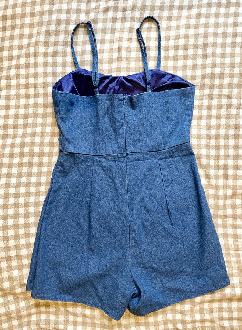 Blue Denim Spaghetti Strap Romper (Category: Rompers) located in Manila. Submitted by tintin_143 (Listing ID 1467403916, Image 2). Description: - Style: Medium blue denim romper with a trendy front skirt overlap and comfy inner shorts - Neckline & Support: Sweetheart neckline with built-in bra cups for extra shape and support - Features: Adjustable straps, secure back zipper closure, and soft inner lining - Condition: Excellent / Like new - Perfe