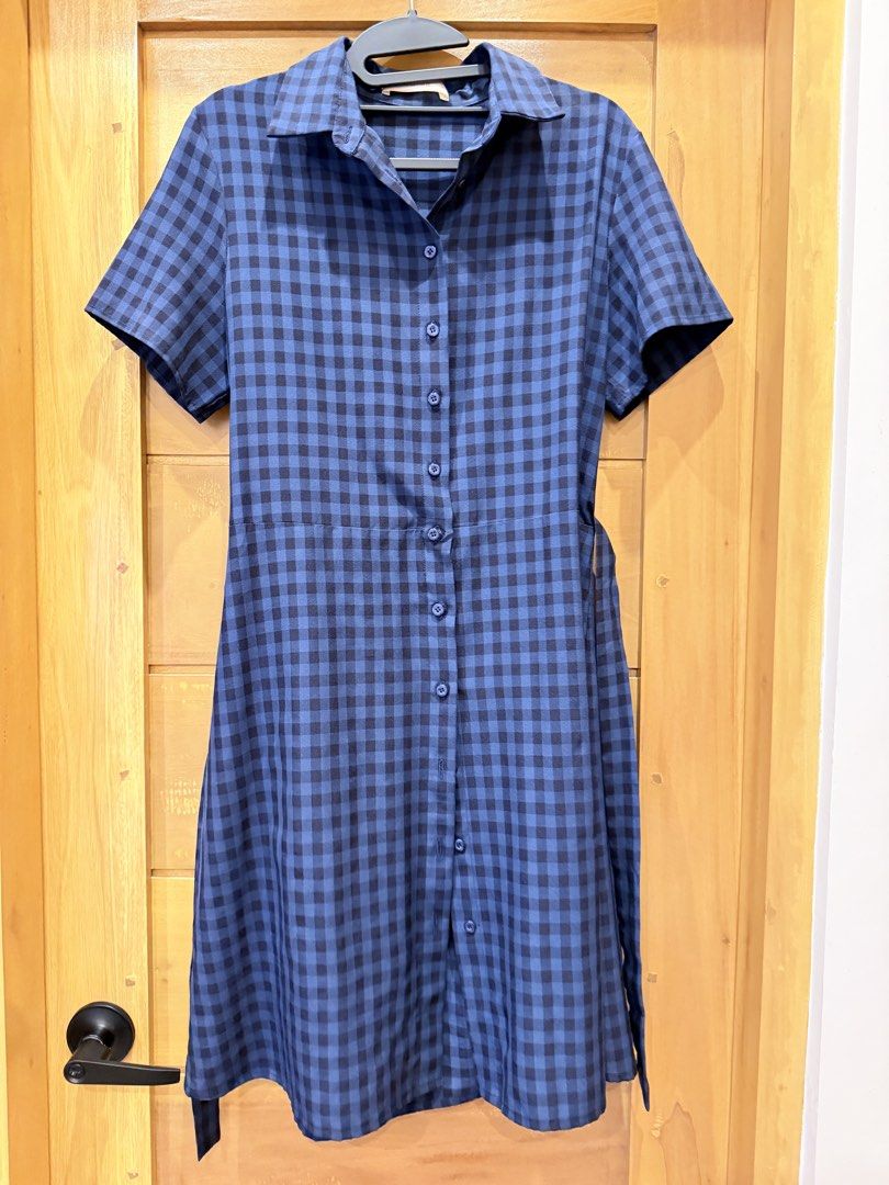 Blue Gingham Shirt Dress with Waist Tie (Category: Dresses) located in Bacoor. Submitted by caramelcart (Listing ID 1467488564, Image 1). Description: - Style: Checkered midi dress in blue and dark blue - Features: Short sleeves, classic collar, and full front button-down closure - Accessories: Includes a matching fabric belt to cinch the waist - Fabric: Lightweight with a nice drape - Condition: Excellent, worn just a few times, clean, and ready