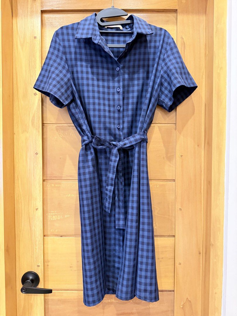 Blue Gingham Shirt Dress with Waist Tie (Category: Dresses) located in Bacoor. Submitted by caramelcart (Listing ID 1467488564, Image 2). Description: - Style: Checkered midi dress in blue and dark blue - Features: Short sleeves, classic collar, and full front button-down closure - Accessories: Includes a matching fabric belt to cinch the waist - Fabric: Lightweight with a nice drape - Condition: Excellent, worn just a few times, clean, and ready