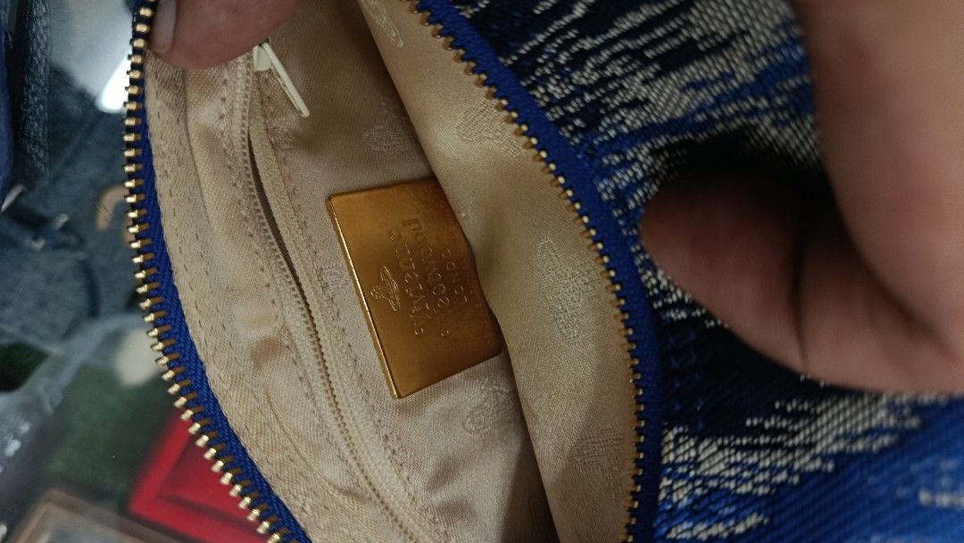 Blue Patterned Crossbody Bag with Gold Hardware (Category: Cross-body Bags) located in Aritao. Submitted by steal.diel (Listing ID 1467473455, Image 3). Description: - Stylish blue and silver patterned crossbody bag - Textured fabric exterior with secure zip closure - Elegant gold tone zipper pull and front orb detail - Comfortable, adjustable blue strap with gold buckle hardware - Roomy interior, perfect for everyday use.
