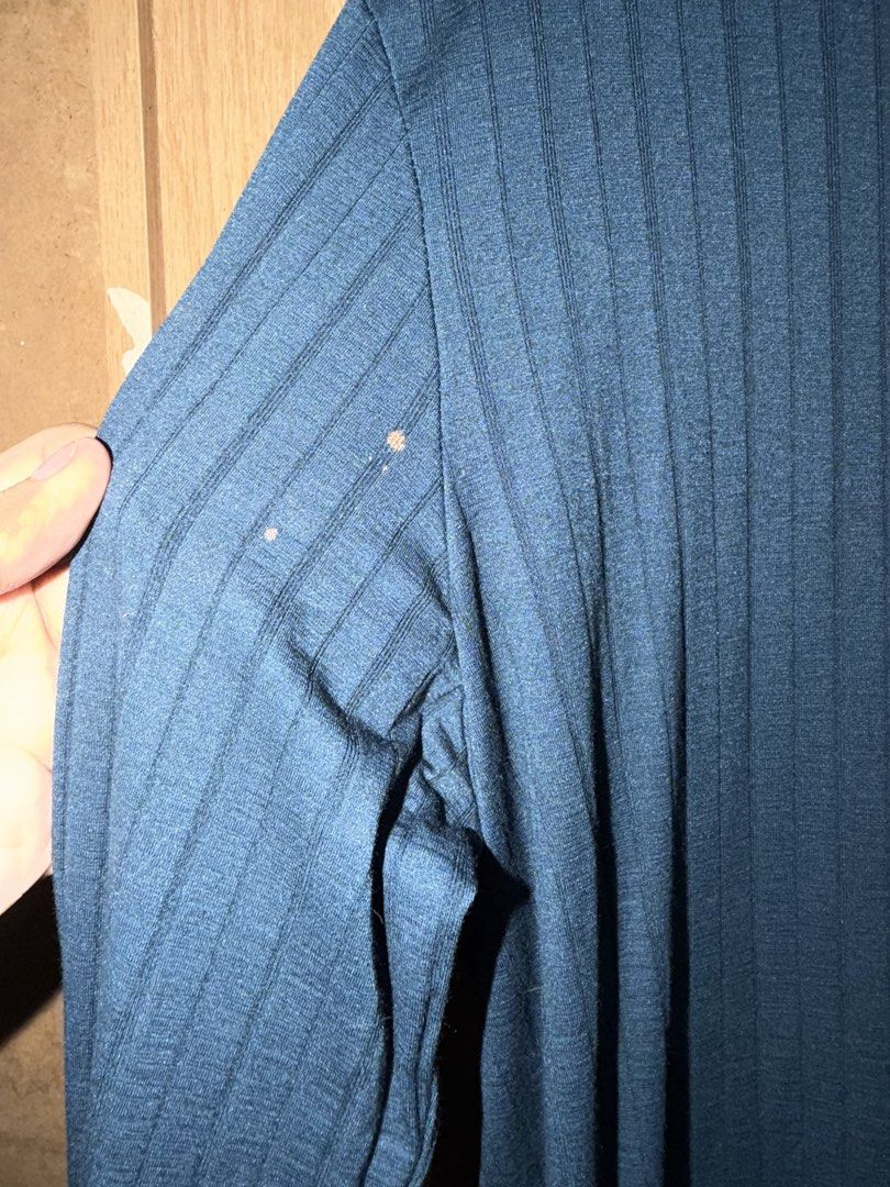 Blue Ribbed Long Sleeve Polo Shirt (Category: Longsleeves) located in Manila. Submitted by marclouiea70819 (Listing ID 1467563196, Image 2). Description: - Color: Blue - Style: Long sleeve polo shirt with vertical ribbed texture and single-button placket - Fabric: Soft and lightweight - Condition: Decent overall condition, clean and ready to wear - Flaw: Small bleach stain on the upper right sleeve near the shoulder seam - Measurements: Available
