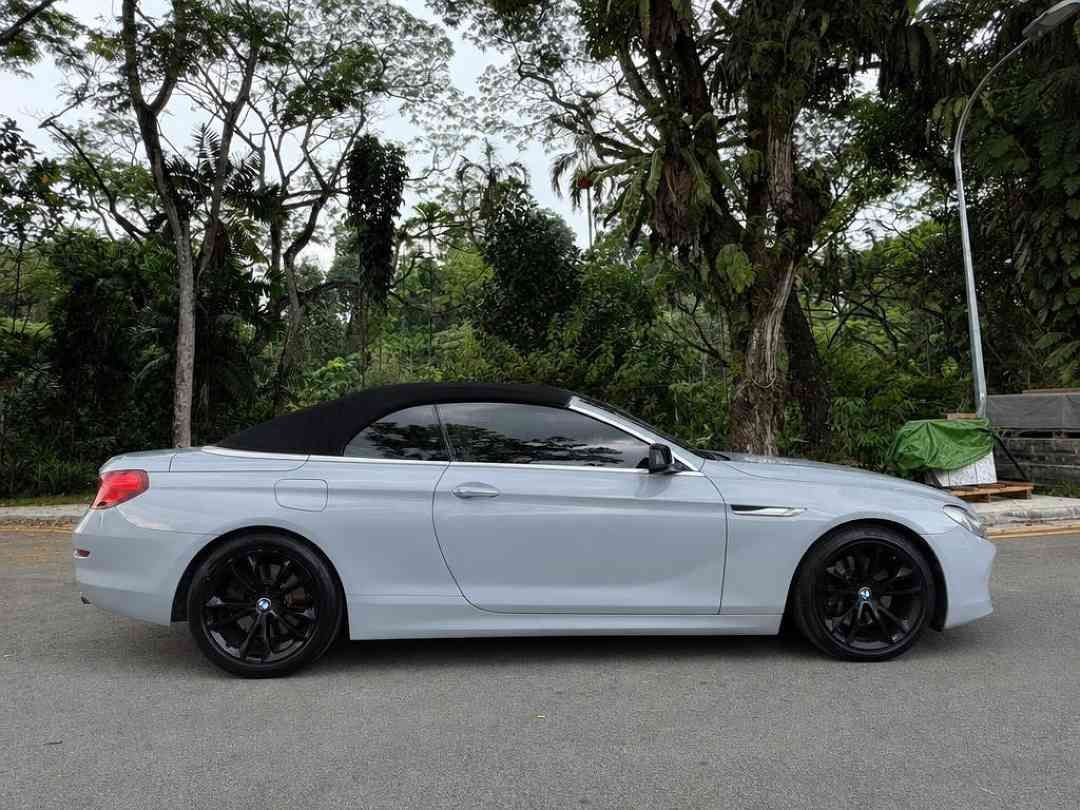 BMW 6 Series Convertible 640i (A) (Category: Used Cars) located in Singapore. Submitted by carousell_certified_partners (Listing ID 1462862339, Image 3). Description: Beautiful BMW 640i Cabriolet! Cheapest in SG! Lowest depreciation! Well kept unit! 100% full loan available! 12-24 Months Warranty by MTM Available! Buy with confidence! In house loan or bank loan available! Fast and easy loan approval! All our vehicles has undergone a 120 points ch