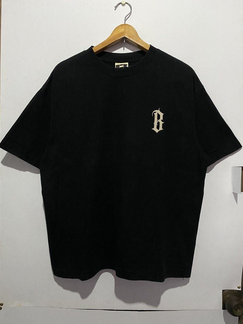 Boneless Black Graphic Tee (Category: Tshirts & Polo Shirts ) located in Jaen. Submitted by oshimamark58418 (Listing ID 1467553173, Image 2). Description: - Brand: Boneless - Color: Black - Size: S (Approx. 23" x 27" based on manual measurement) - Design: Small 'B' logo on chest; large 'B' graphic and 'Tasteless, pointless and fearless' text on the back - Condition: Clean fabric with solid, high-quality print.