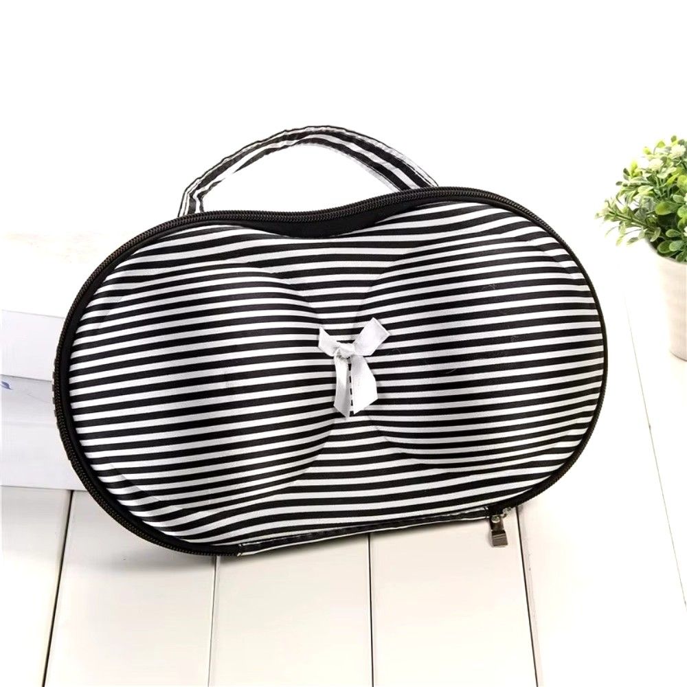 Bra Storage Bag (Category: Purses & Pouches) located in Valenzuela. Submitted by diane.35 (Listing ID 1467393264, Image 3). Description: Black and white striped storage case designed specifically for bras and undergarments. Molded cups help maintain shape during travel or daily storage. Cute white ribbon accent on the front. Sturdy zipper closure all around with a top handle for easy carrying. Keeps your intimates organized and protected..