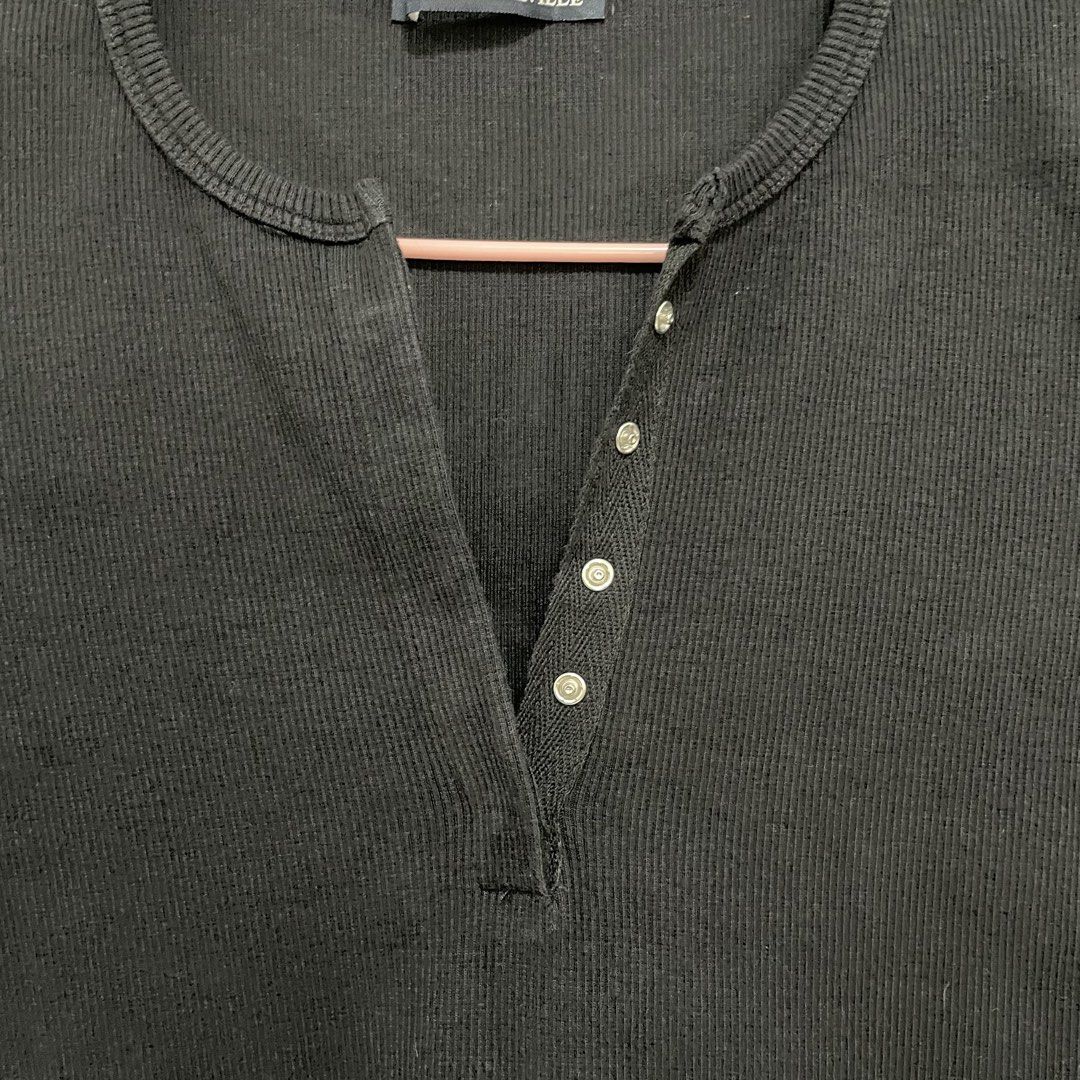 Brandy Melville Black Ribbed Button-Up Top (Category: Shirts) located in Pasay City. Submitted by lovedbyzea (Listing ID 1467528382, Image 3). Description: - black in actual, not faded - Brand: Brandy Melville - Style: Black ribbed short-sleeve top with scoop neckline - Details: Split placket with silver-tone snap buttons down the front - Material: Stretchy, comfortable cotton rib fabric - Versatility: Essential basic piece that pairs easily with